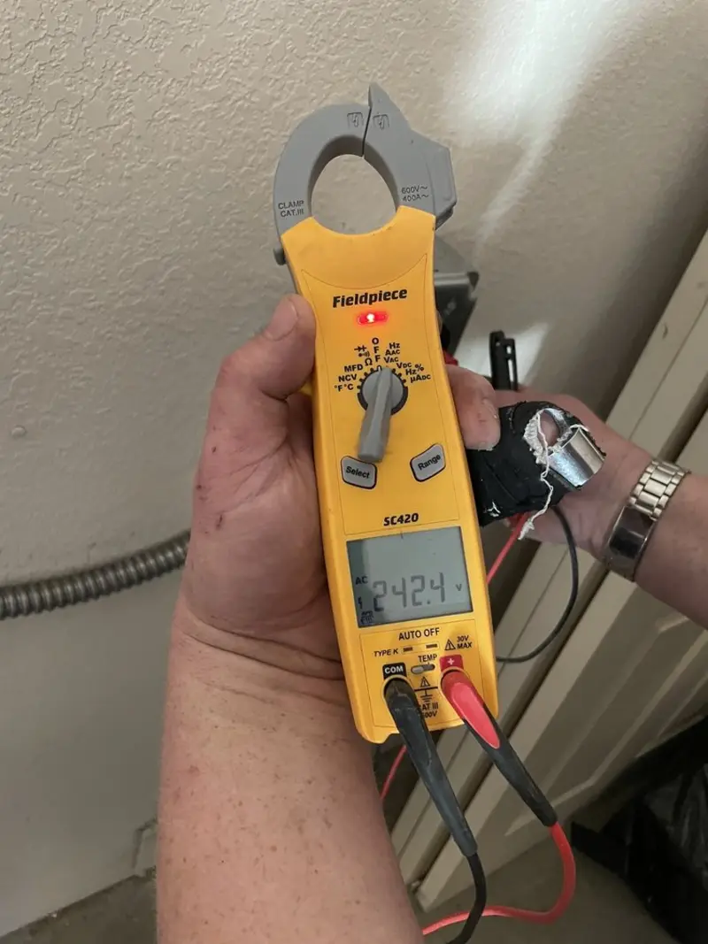 Voltage testing with clamp meter during Outlet Installation in Holden